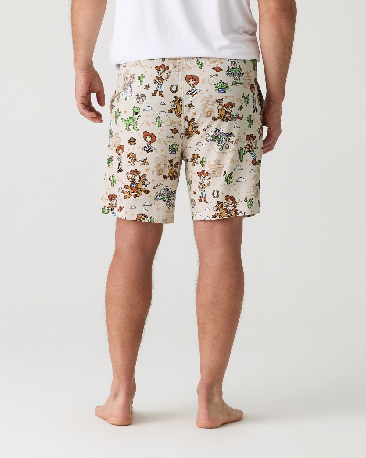 Back view of man wearing the Disney & Pixar Woody's Wild West Men's Pajama Shorts
