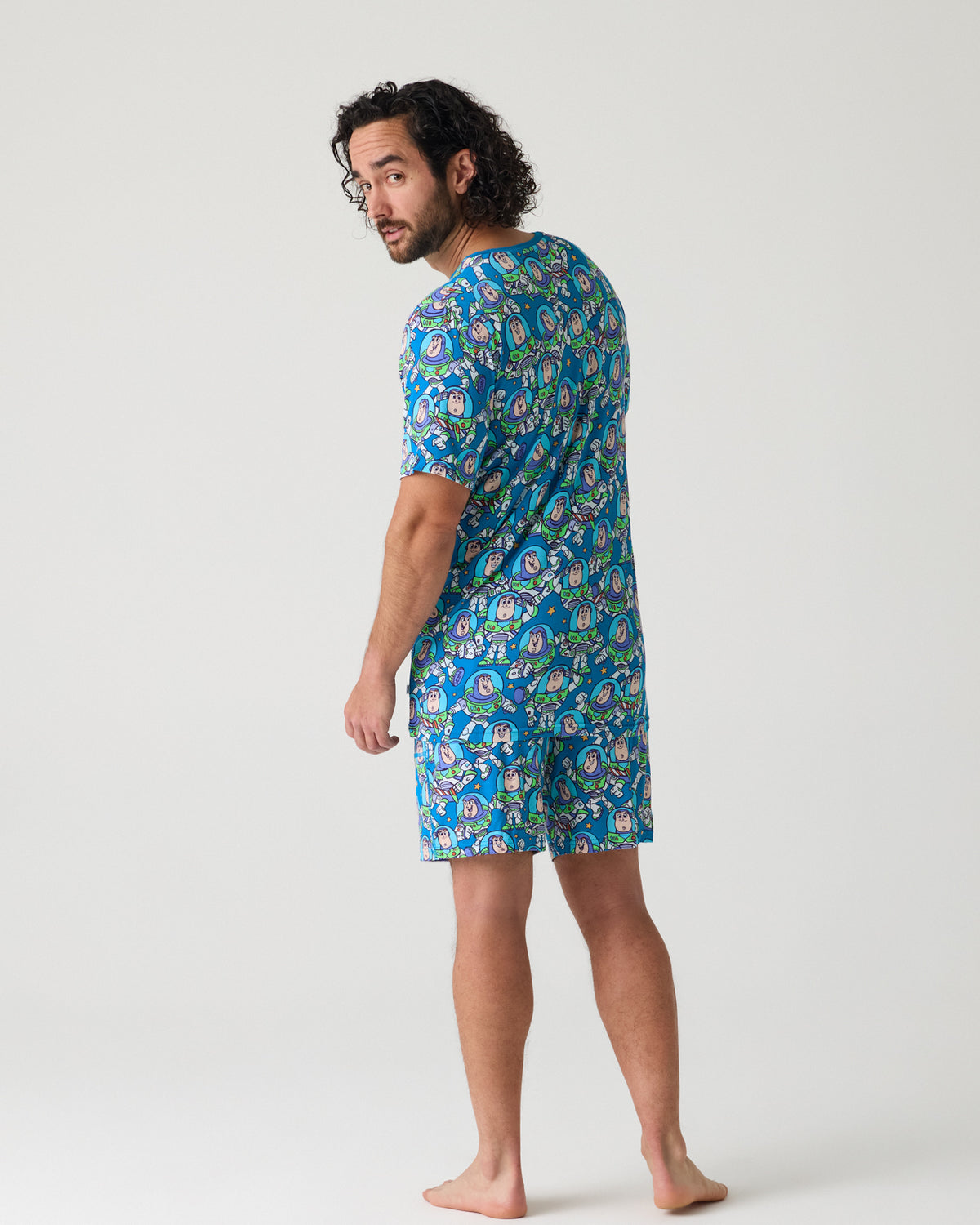 Back view of man wearing the Disney & Pixar Buzz's Cosmic Crew Men's Short Sleeve Pajama Top and Shorts