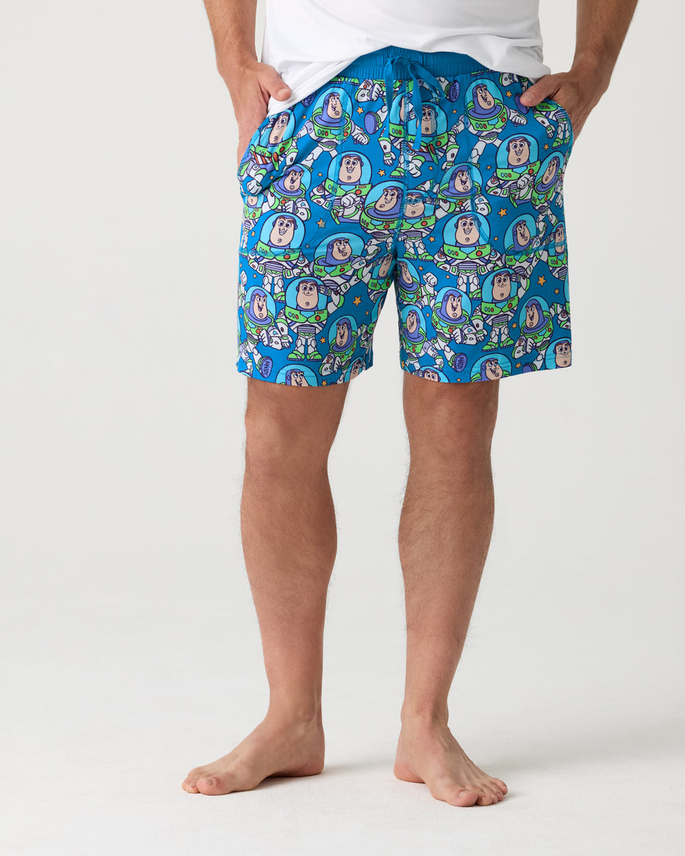 Man wearing the Disney & Pixar Buzz's Cosmic Crew Men's Pajama Shorts
