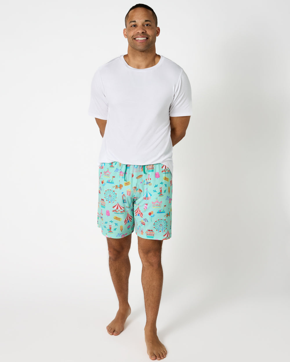 Man wearing the Fizzy Fair Men's Pajama Shorts with a white PJ top