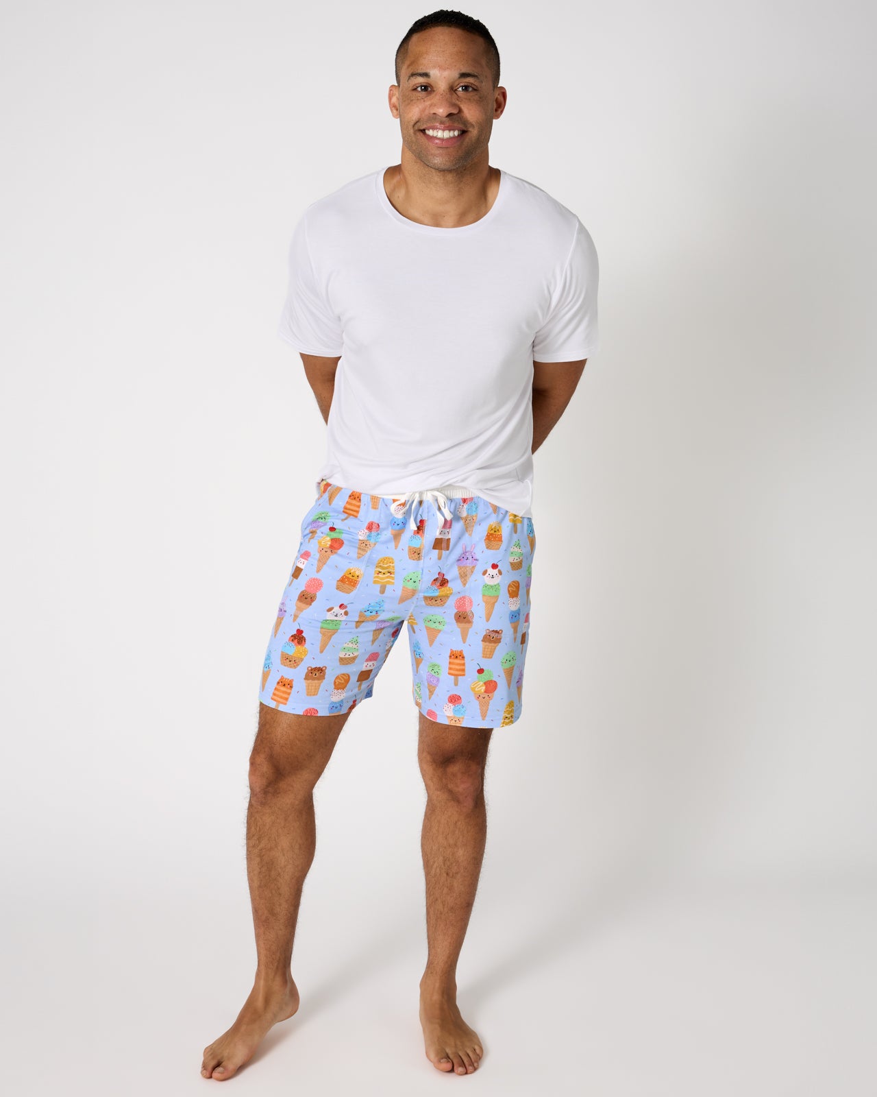 Man wearing the Scoop Squad Men's Pajama Shorts with a white PJ top