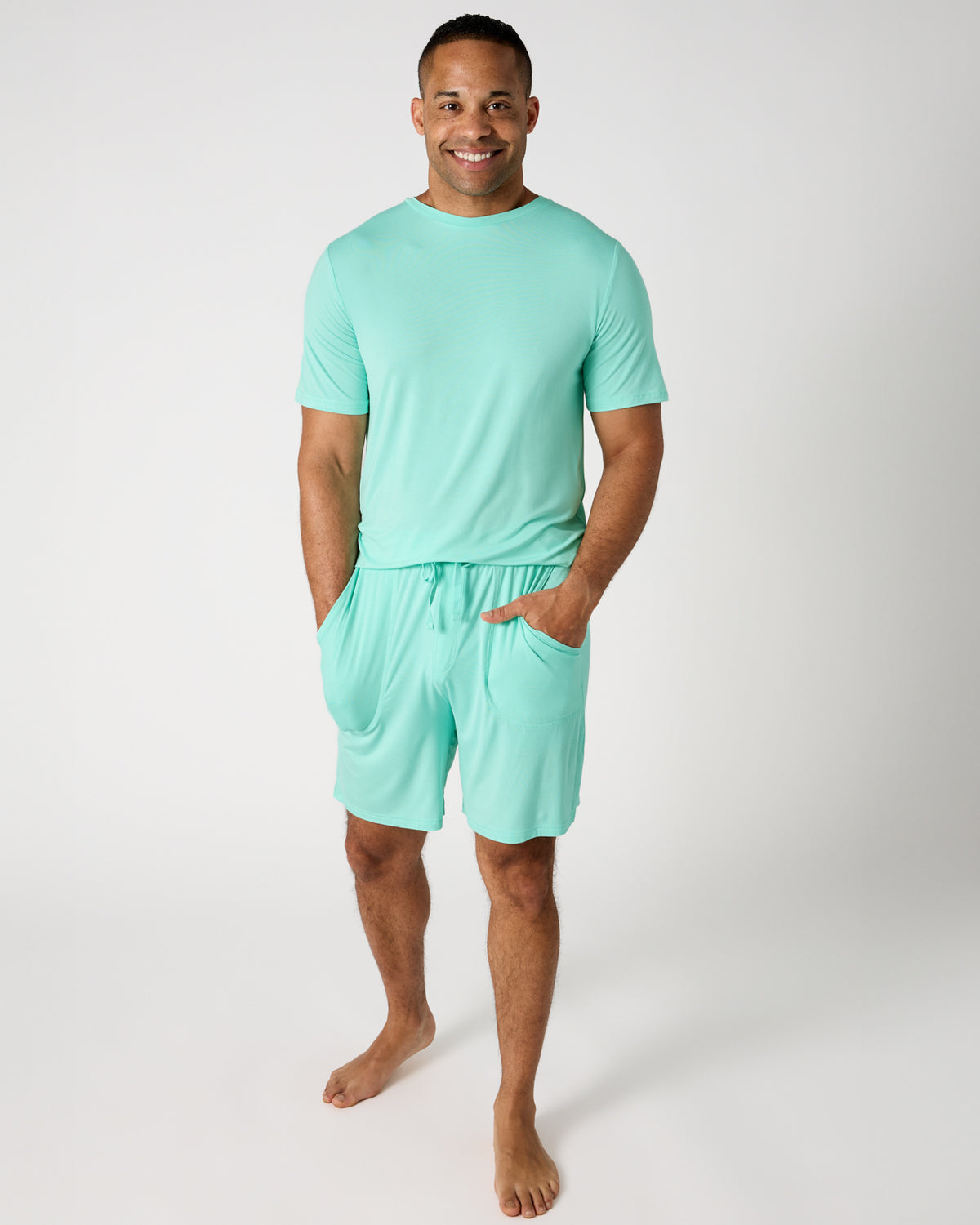 Man wearing the Blue Ocean Mist Men's Short Sleeve Pajama Top and Shorts