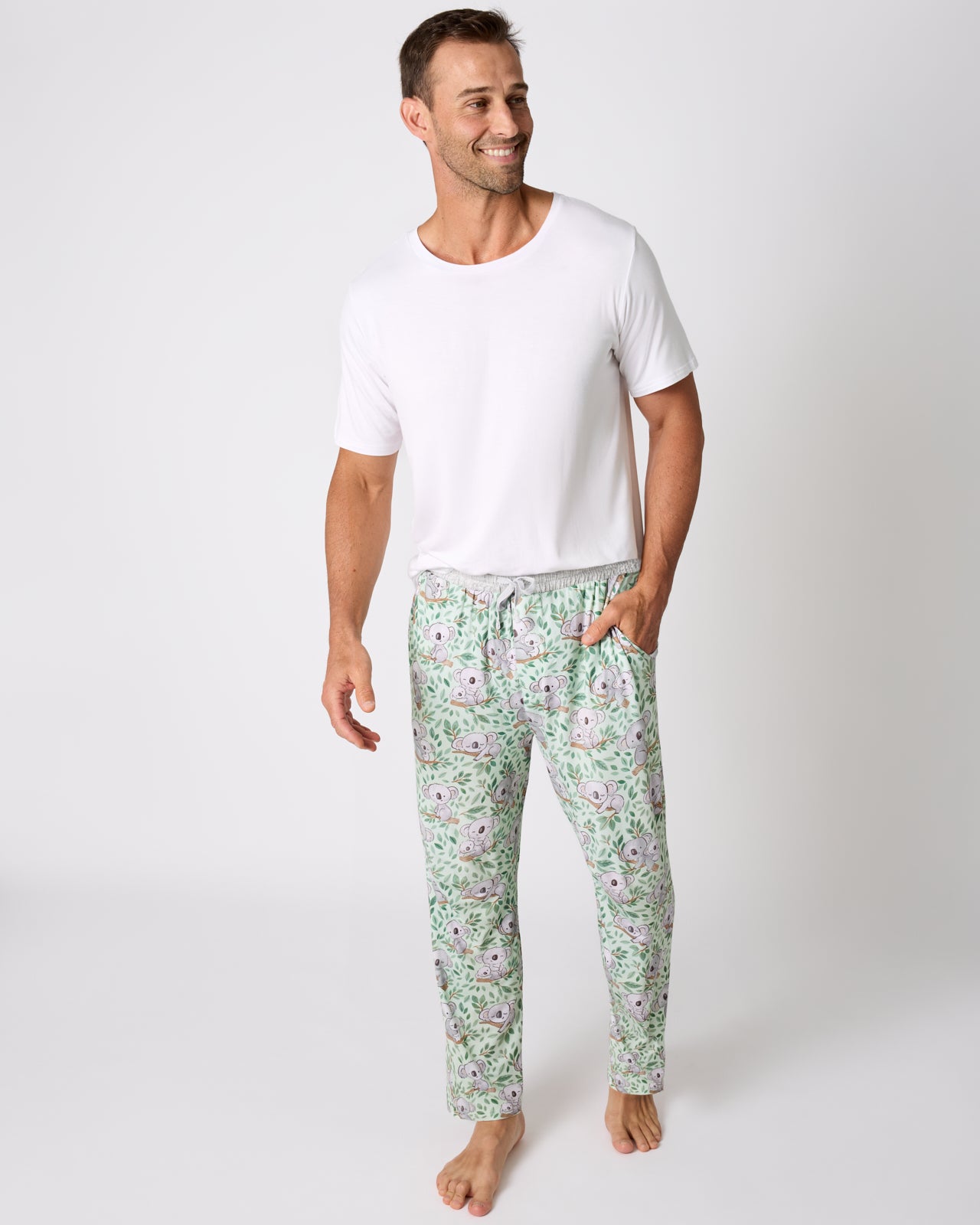 Man wearing the Koala Cuddles Men's Pajama Pants with a white tee
