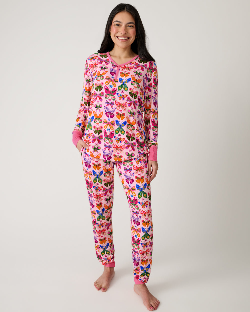 Standing woman wearing the Flutter Garden Women's Pajama Pants and Top