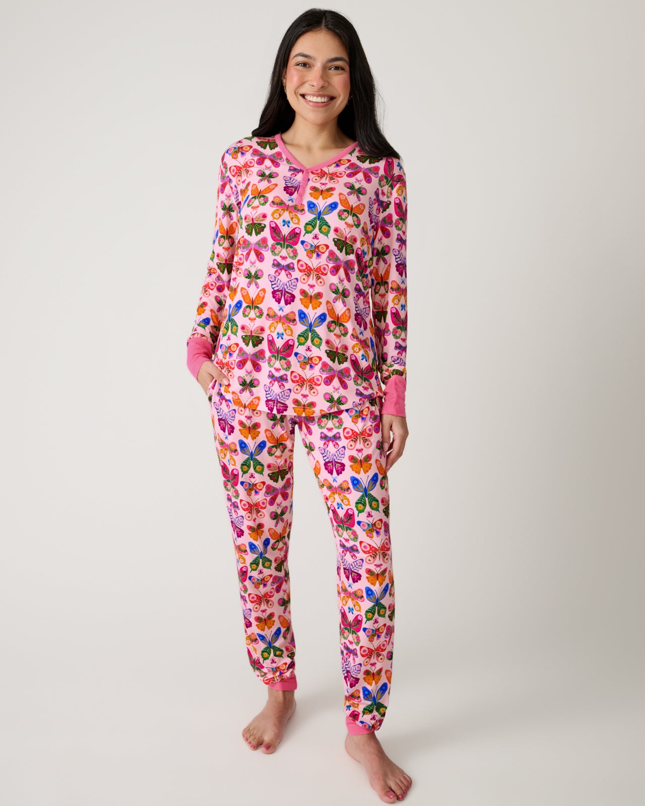 Standing woman wearing the Flutter Garden Women's Pajama Pants and Top