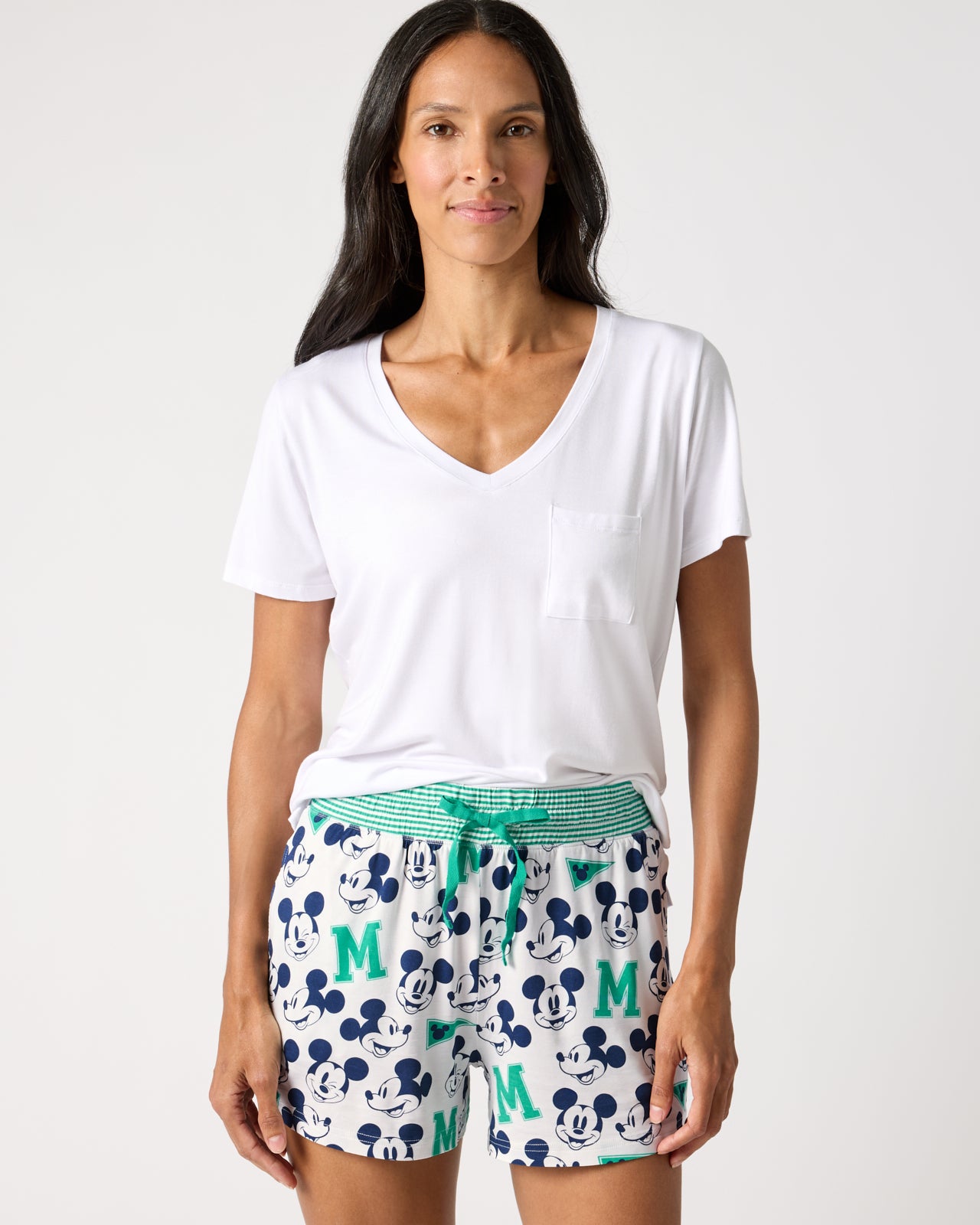 Woman wearing the Disney Varsity Mickey Mouse Women's Pajama Shorts and White Top