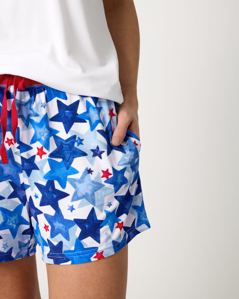 Close up of woman wearing the Starry Splash Women's Pajama Shorts