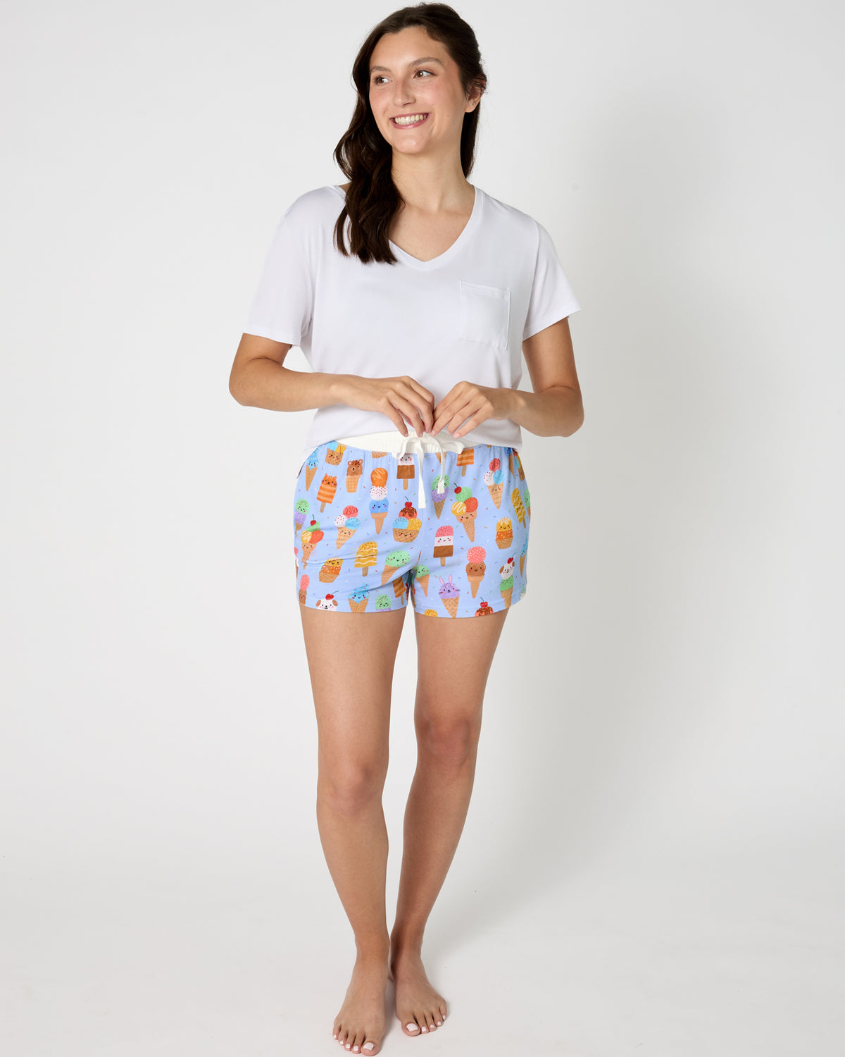 Woman wearing the Scoop Squad Women's Pajama Shorts with a white PJ top
