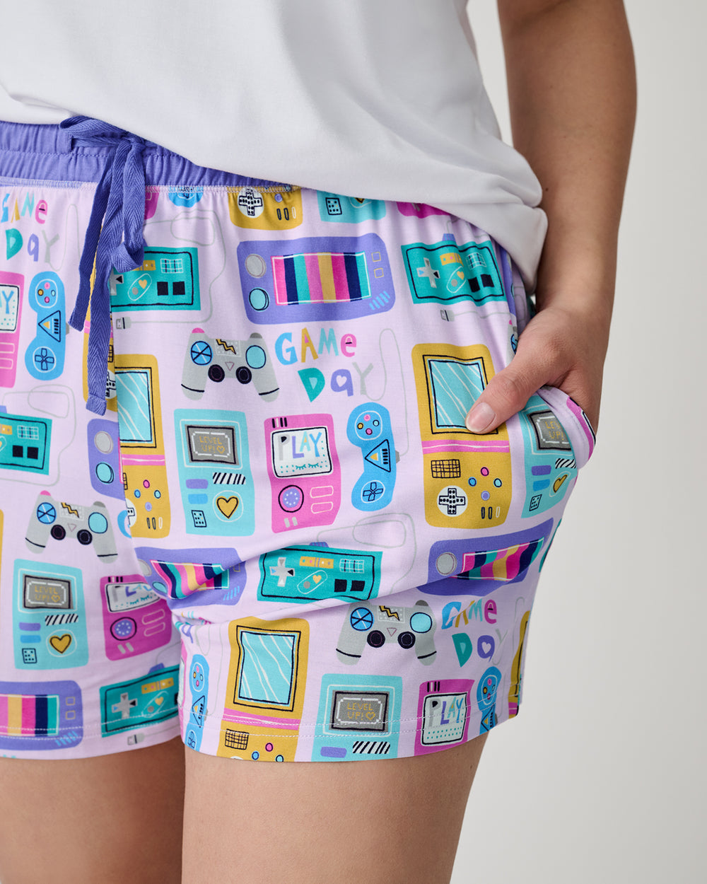 Close up of woman wearing the Purple Game On Women's Pajama Shorts