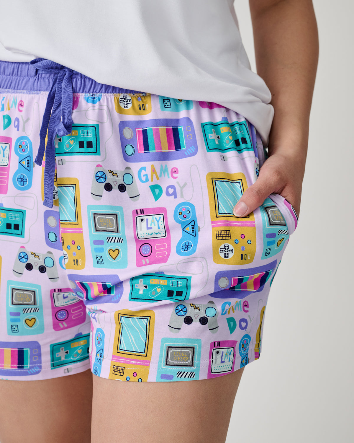 Close up of woman wearing the Purple Game On Women's Pajama Shorts