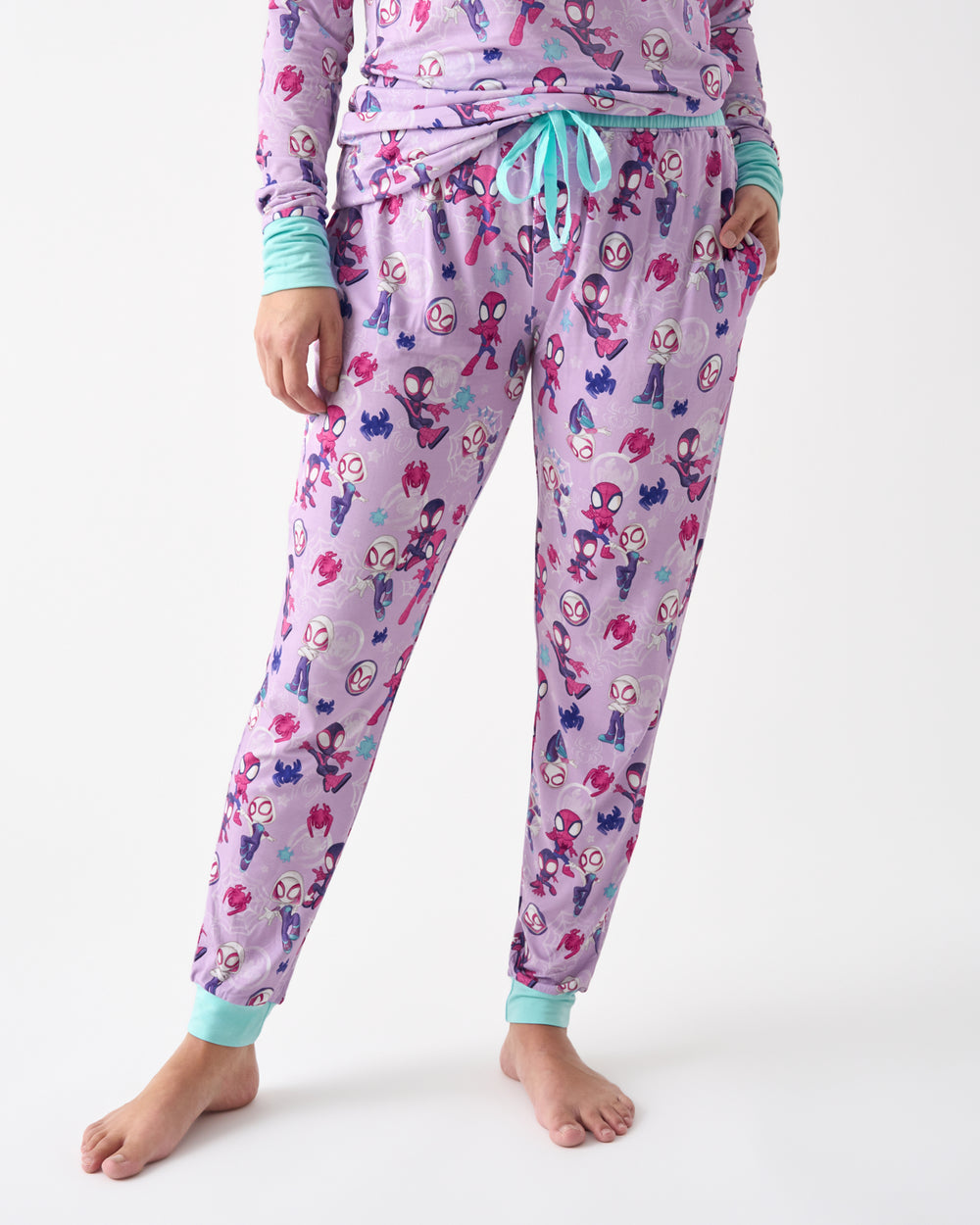 Woman wearing the Purple Spidey & Friends Tiny Webs Women's Pajama Pants