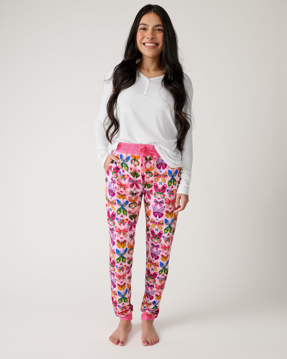 Woman wearing the Flutter Garden Women's Pajama Pants with a white top