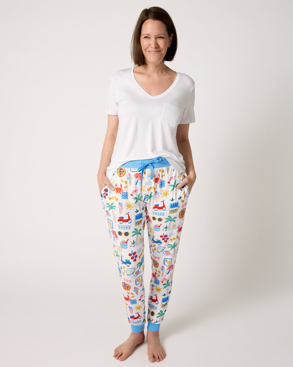 Woman wearing the Ciao Bella Women's Pajama Pants with a white PJ top