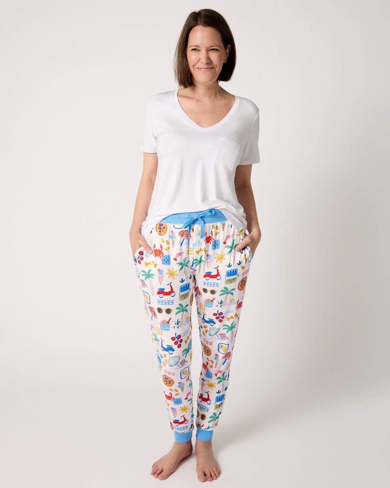 Woman wearing the Ciao Bella Women's Pajama Pants with a white PJ top