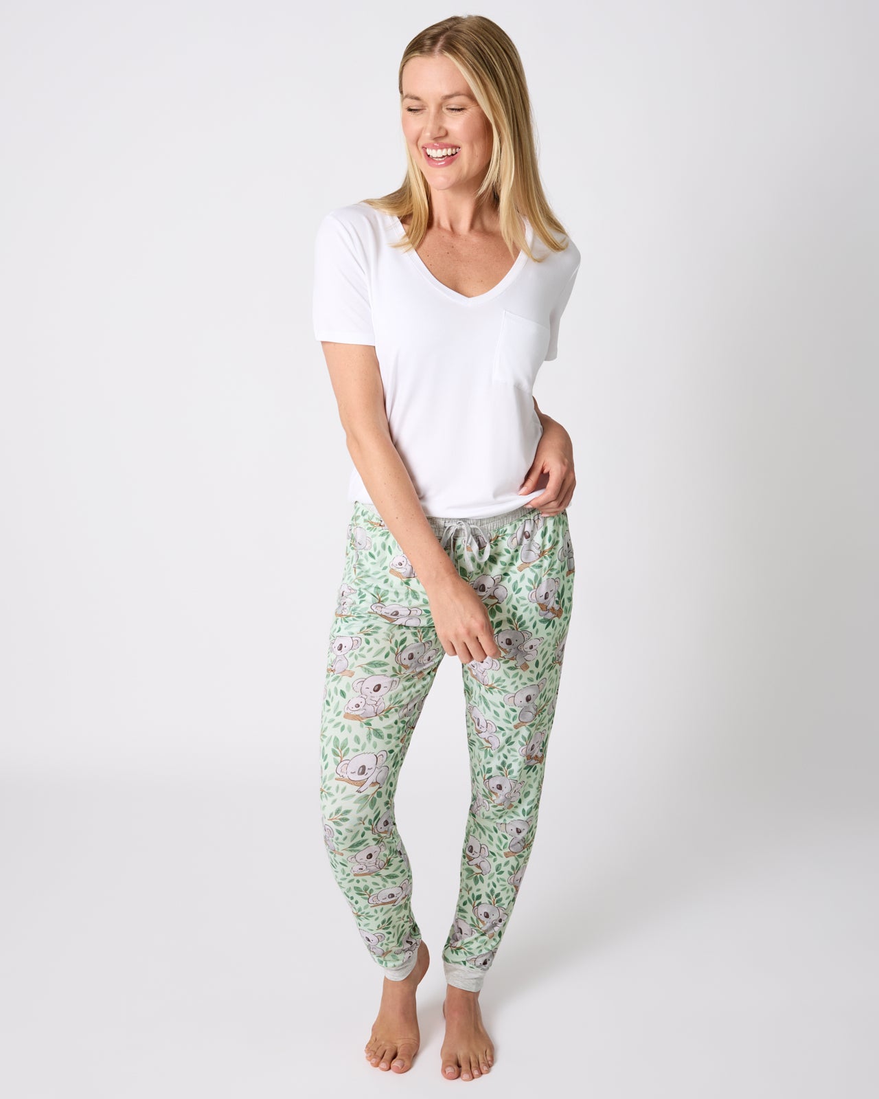 Woman wearing the Koala Cuddles Women's Pajama Pants with a white tee