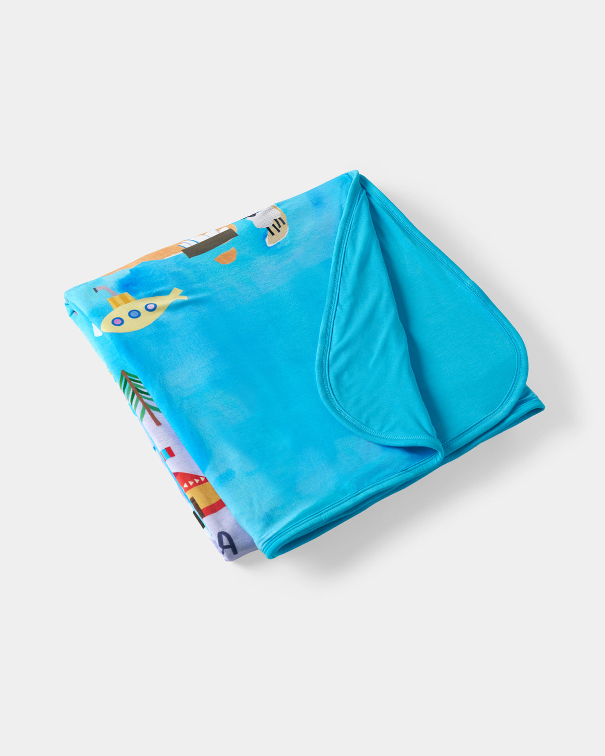 Flat lay of the Around The World Large Cloud Blanket®