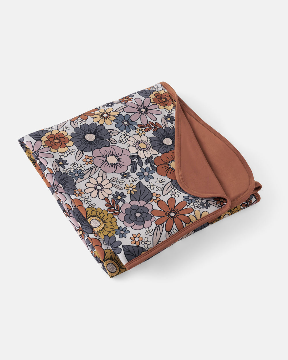 Flat lay of the Wildwood Floral Large Cloud Blanket®