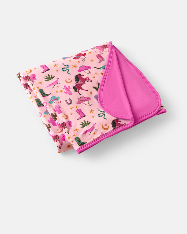 Flat lay of the Pink Rancher Roundup Large Cloud Blanket®