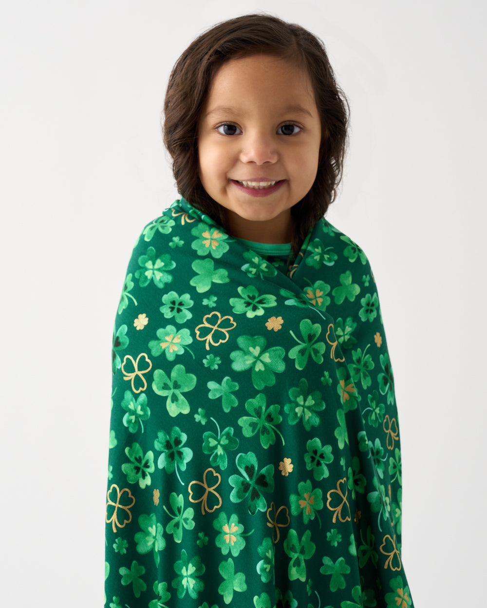 Close up of girl wrapped in the Clover Cuties Large Cloud Blanket®