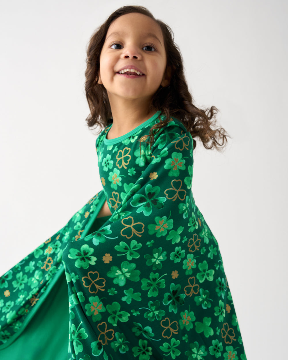 Girl wrapped in the Clover Cuties Large Cloud Blanket®