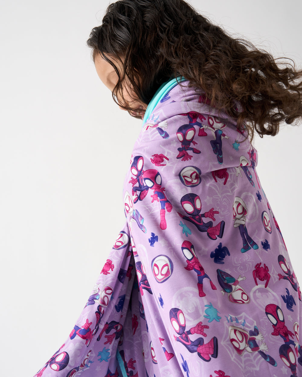 Close up of girl wrapped in the Spidey & Friends Tiny Webs Large Cloud Blanket®