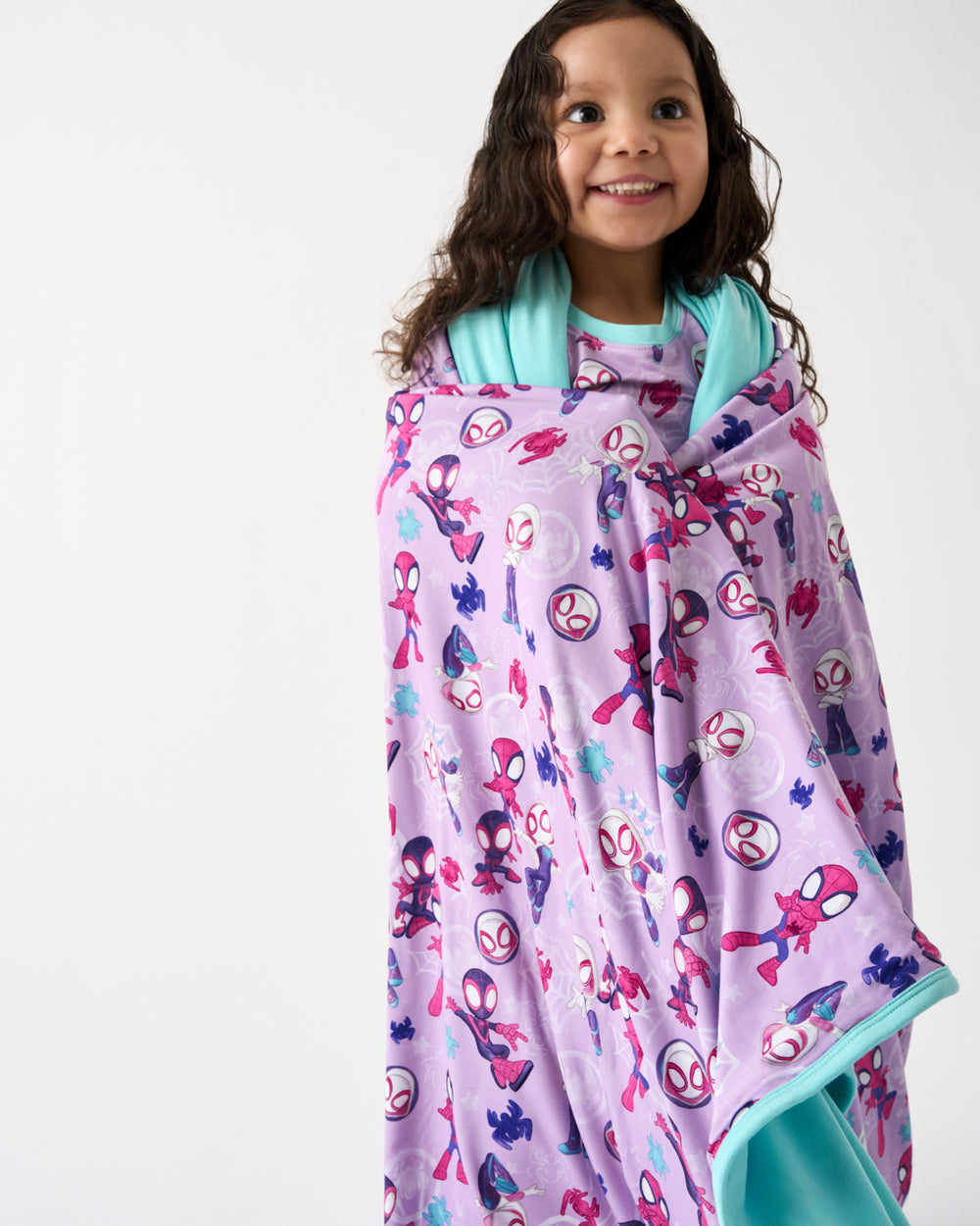 Girl wrapped in the Purple Spidey & Friends Tiny Webs Large Cloud Blanket®