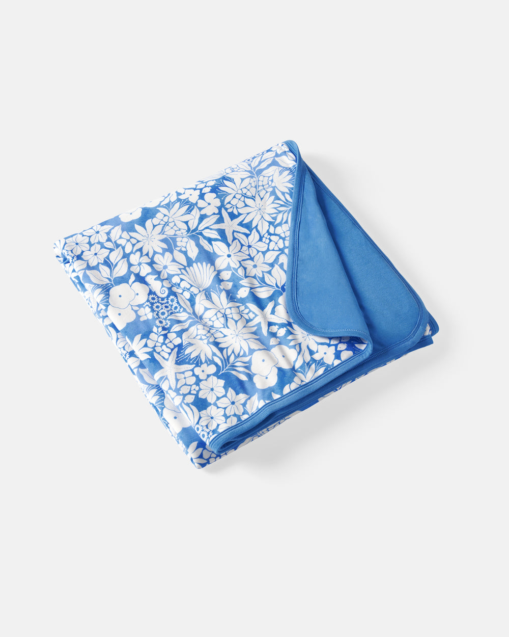 Flat lay of the Azure Garden Large Cloud Blanket®