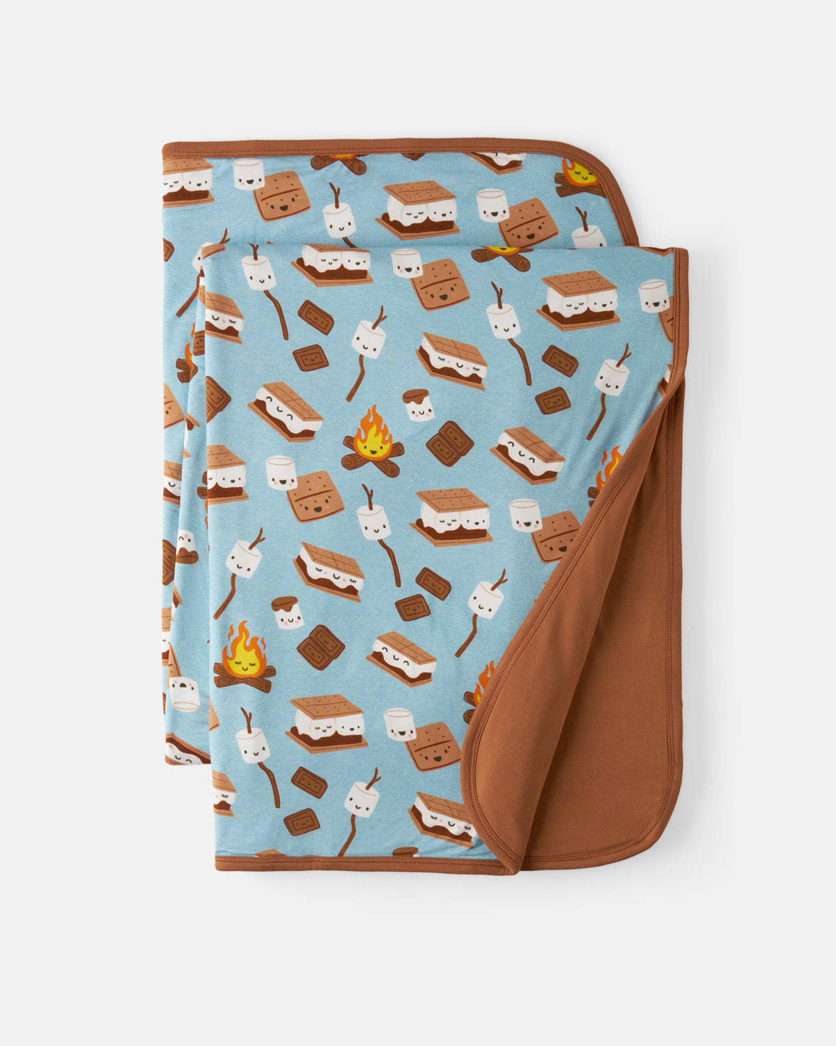 A folded blanket with a light blue background and a repeating s'mores pattern, featuring a solid brown reverse side, shown on a light gray background.
