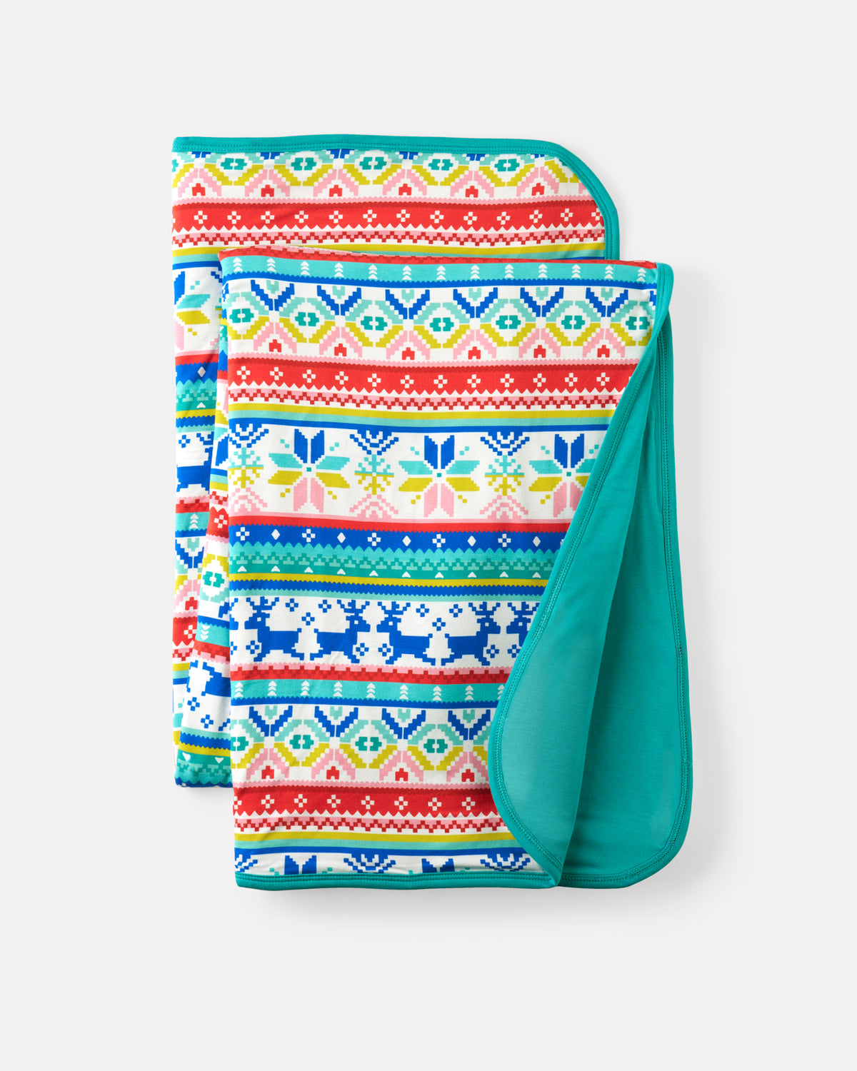 A folded blanket with a colorful Fair Isle pattern featuring snowflakes, geometric designs, and reindeer, with a solid teal reverse side, shown on a light gray background.