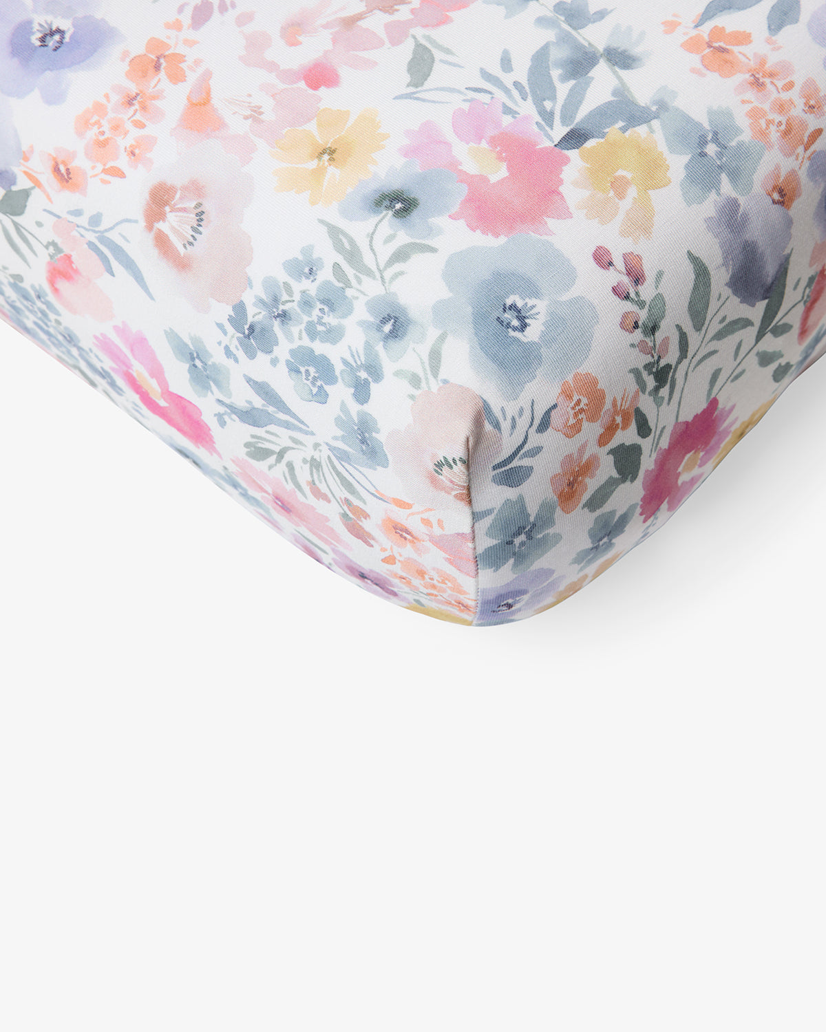 Macro view of the corner of the Tiny Blooms Mini Crib Sheet