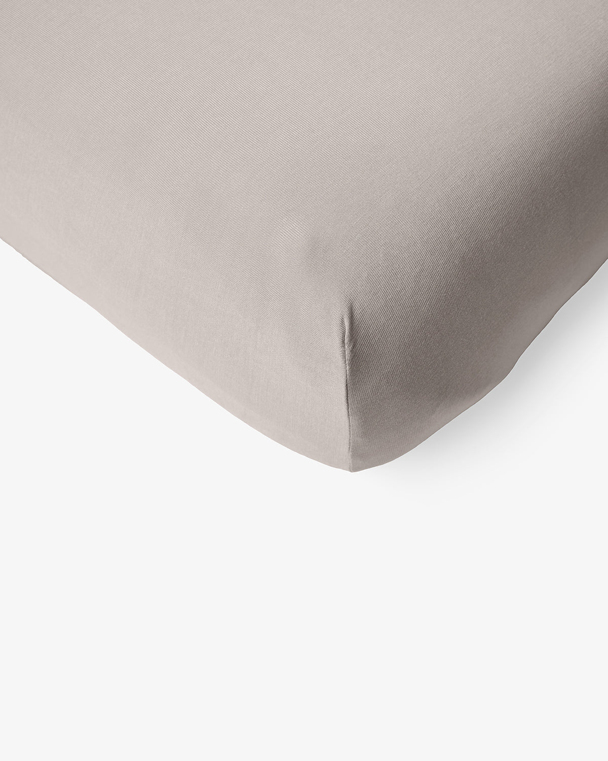 Macro view of the corner of the Dove Gray Mini Crib Sheet