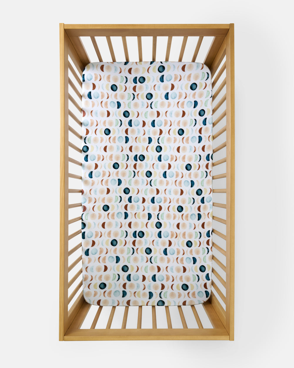 Overhead view of the Luna Neutral Fitted Crib Sheet