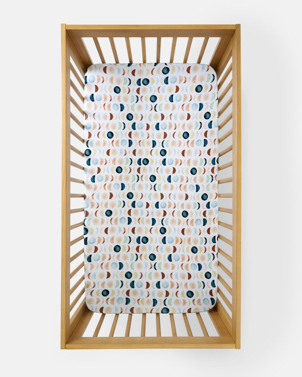 Overhead view of the Luna Neutral Fitted Crib Sheet
