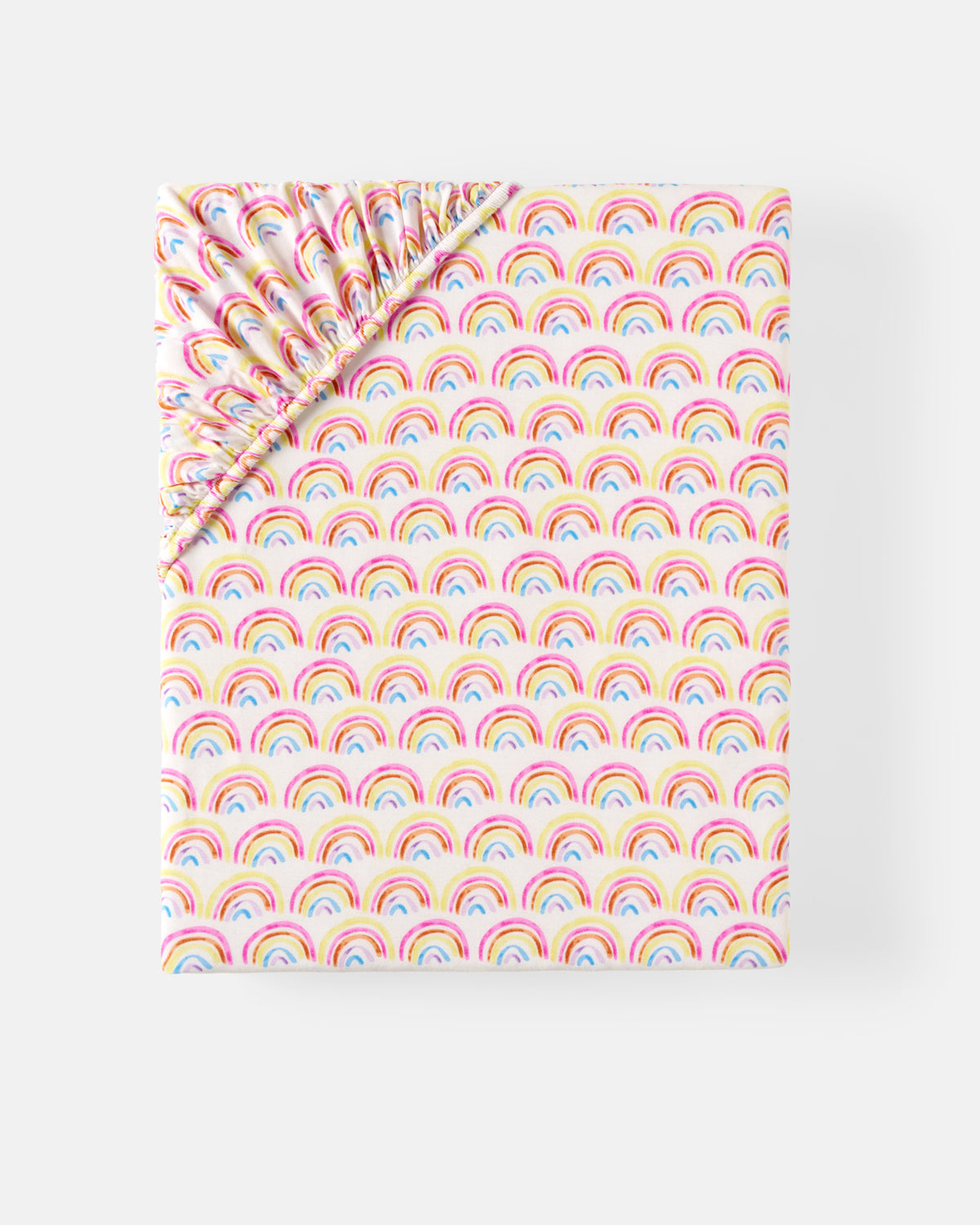 Flat lay of the Pastel Rainbows Fitted Crib Sheet