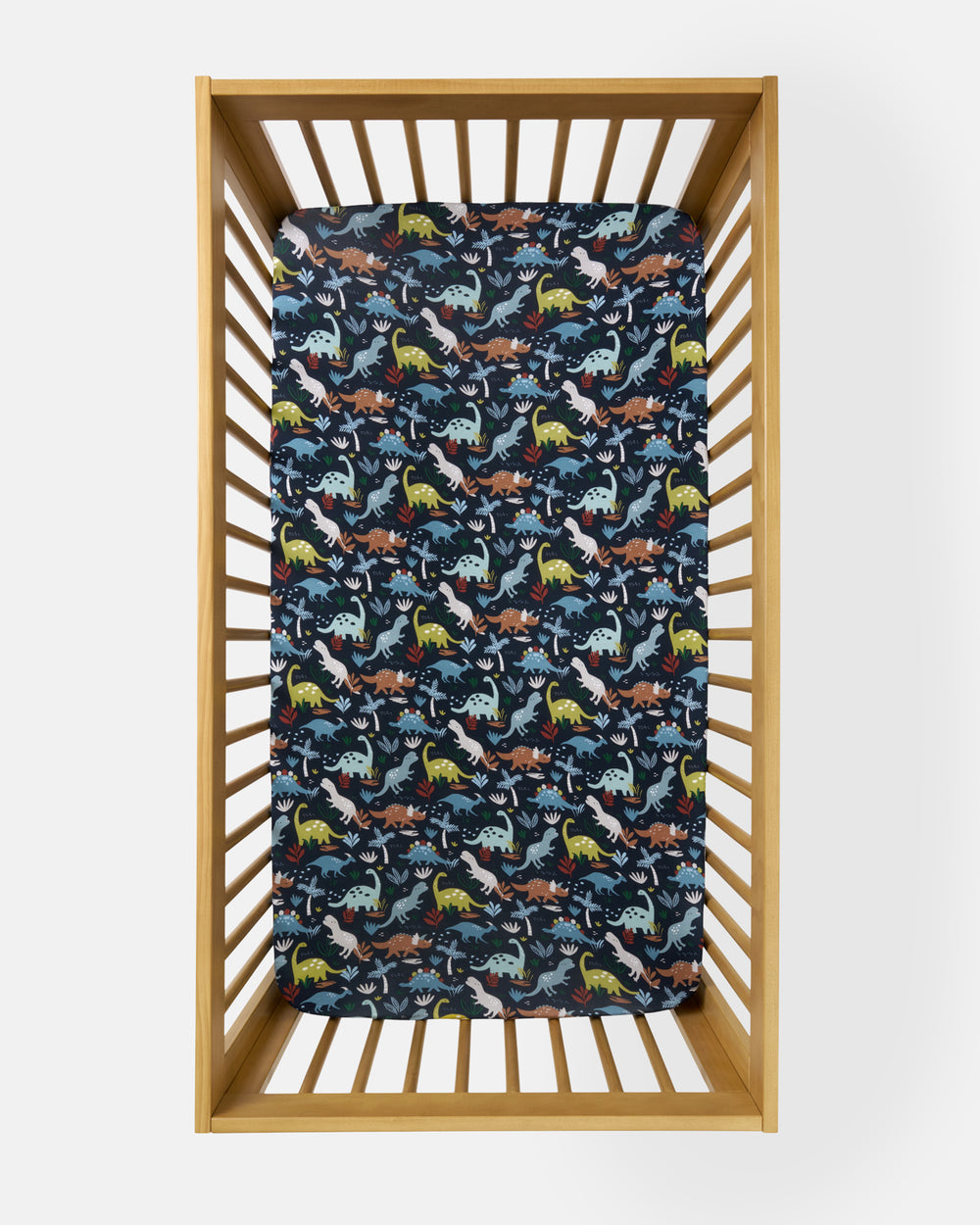Overhead view of the Navy Jurassic Jungle Fitted Crib Sheet