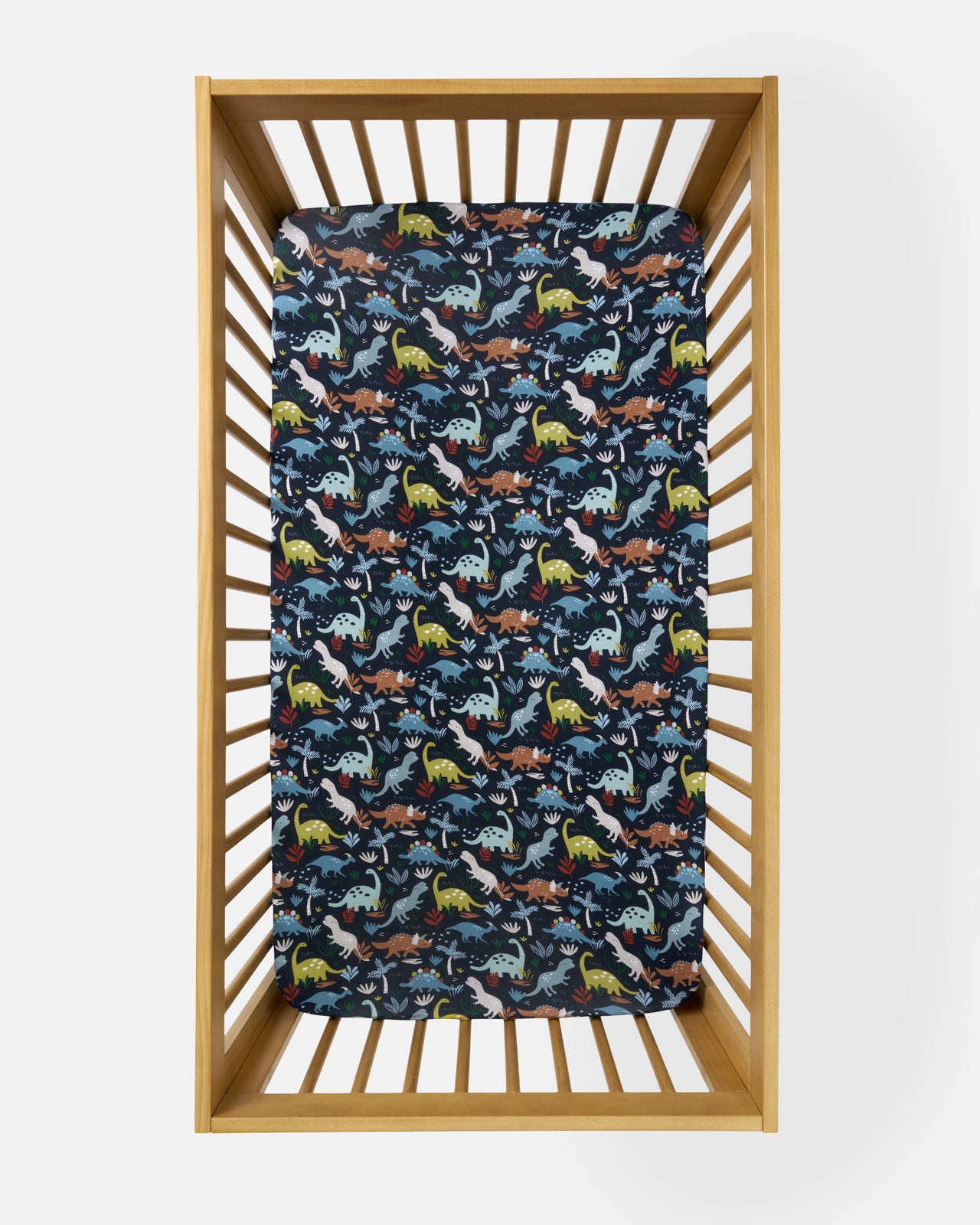 Overhead view of the Navy Jurassic Jungle Fitted Crib Sheet