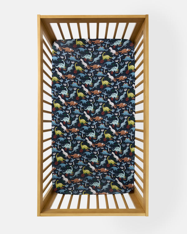 Overhead view of the Navy Jurassic Jungle Fitted Crib Sheet