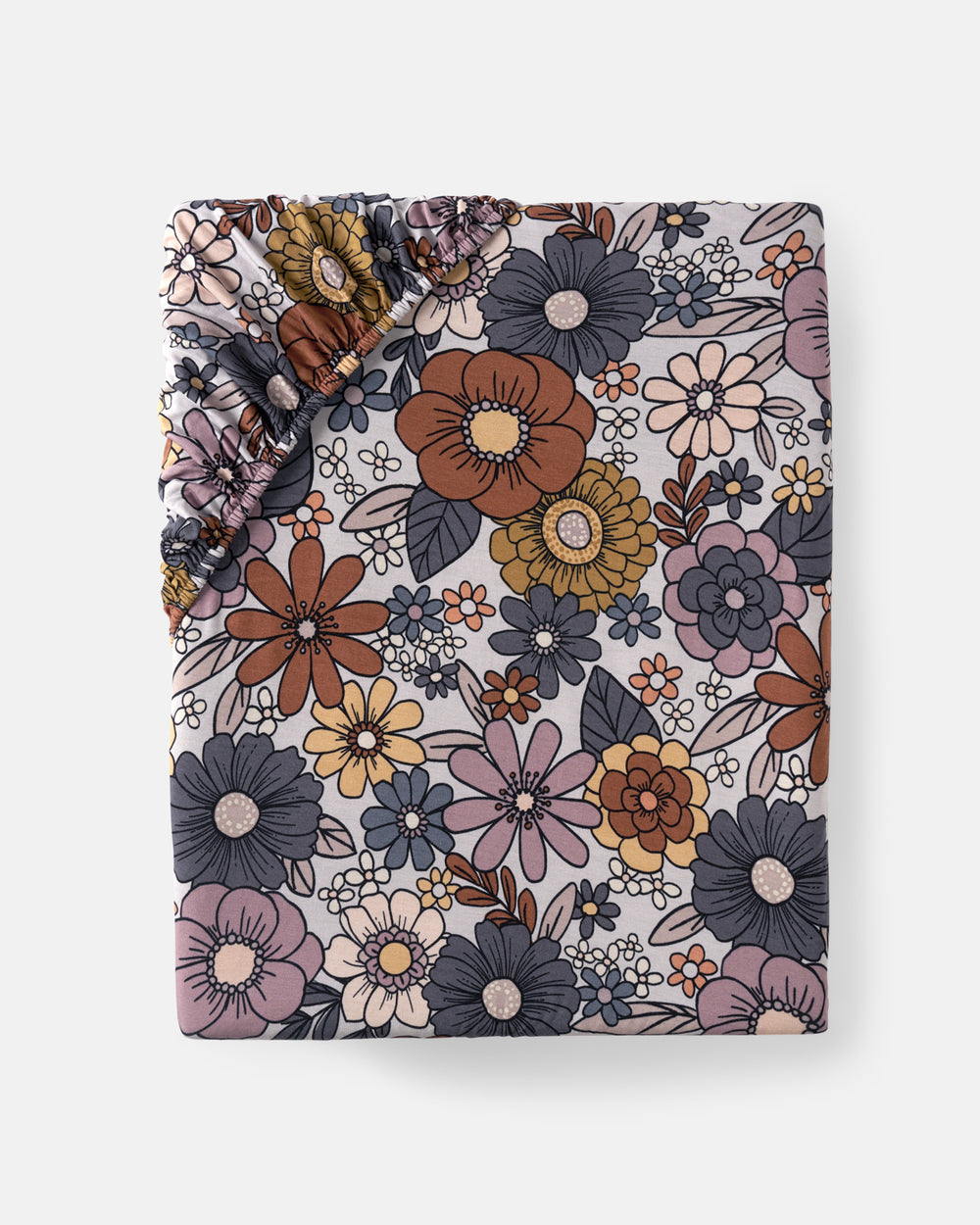 Flat lay of the Wildwood Floral Standard Fitted Crib Sheet