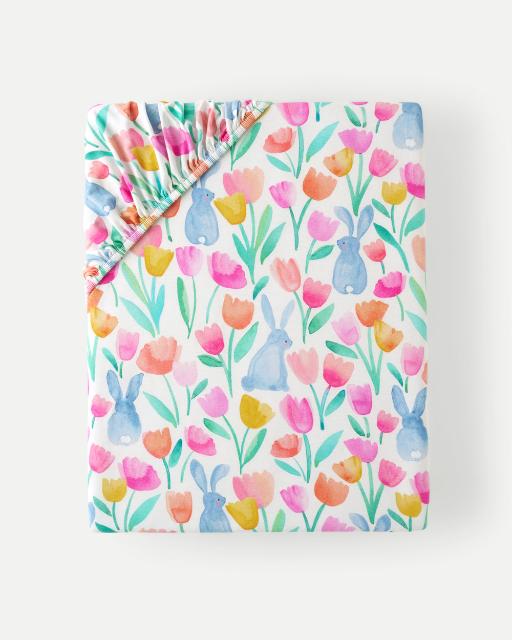 Flat lay of the Garden Hop Fitted Crib Sheet