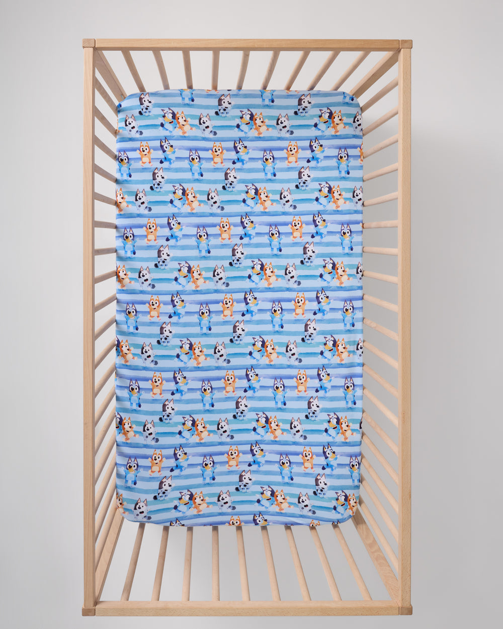 Overhead view of the Bluey Dance All Day Fitted Crib Sheet