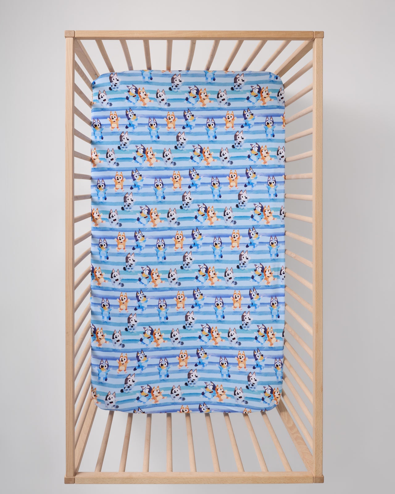 Overhead view of the Bluey Dance All Day Fitted Crib Sheet