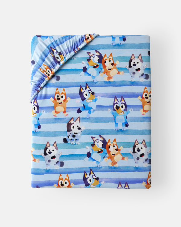 Flat lay of the Bluey Dance All Day Fitted Crib Sheet