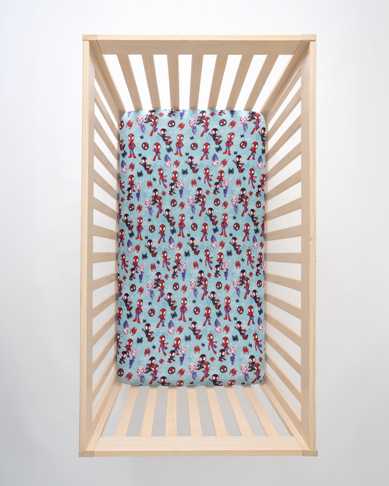 Overhead view of the Spidey & Friends Tiny Webs Fitted Crib Sheet