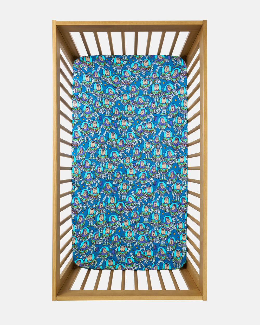 Overhead view of the Disney & Pixar Buzz's Cosmic Crew Fitted Crib Sheet