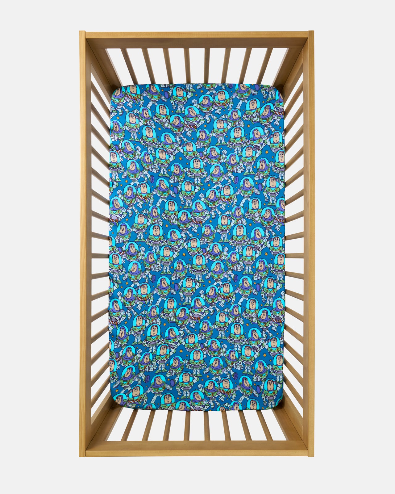 Overhead view of the Disney & Pixar Buzz's Cosmic Crew Fitted Crib Sheet