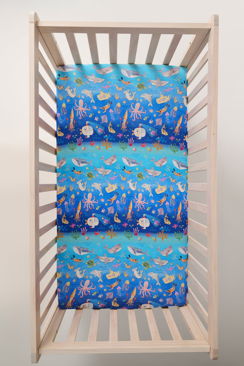 Overhead view of the Underwater Discovery Fitted Crib Sheet