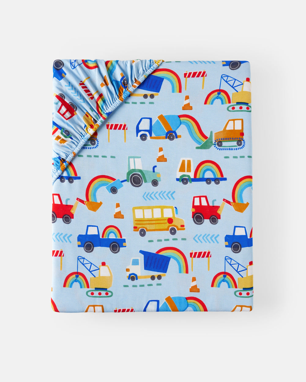 Flat lay of the Rainbow Trucks Fitted Crib Sheet