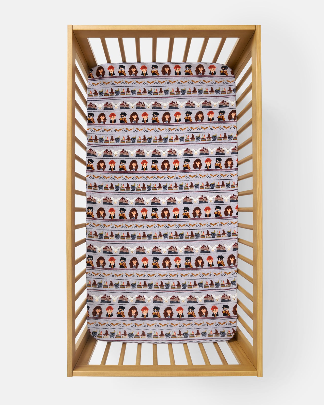 Aerial view of the Harry Potter™ Spellbinding Studies Fitted Crib Sheet