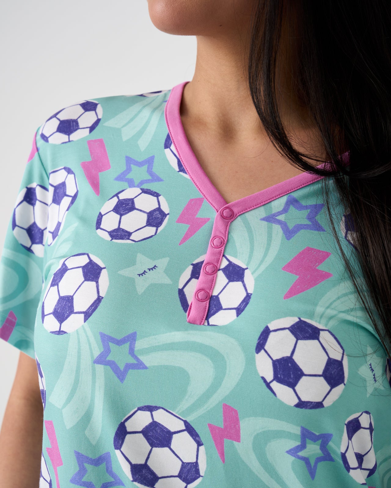 Close up of woman wearing the Aqua Soccer Stars Women's Short Sleeve Pajama Top