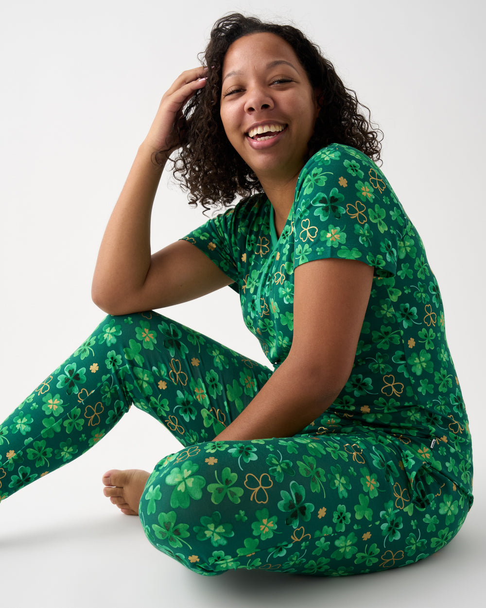 Sitting woman wearing the Clover Cuties Women's Pajama Pants